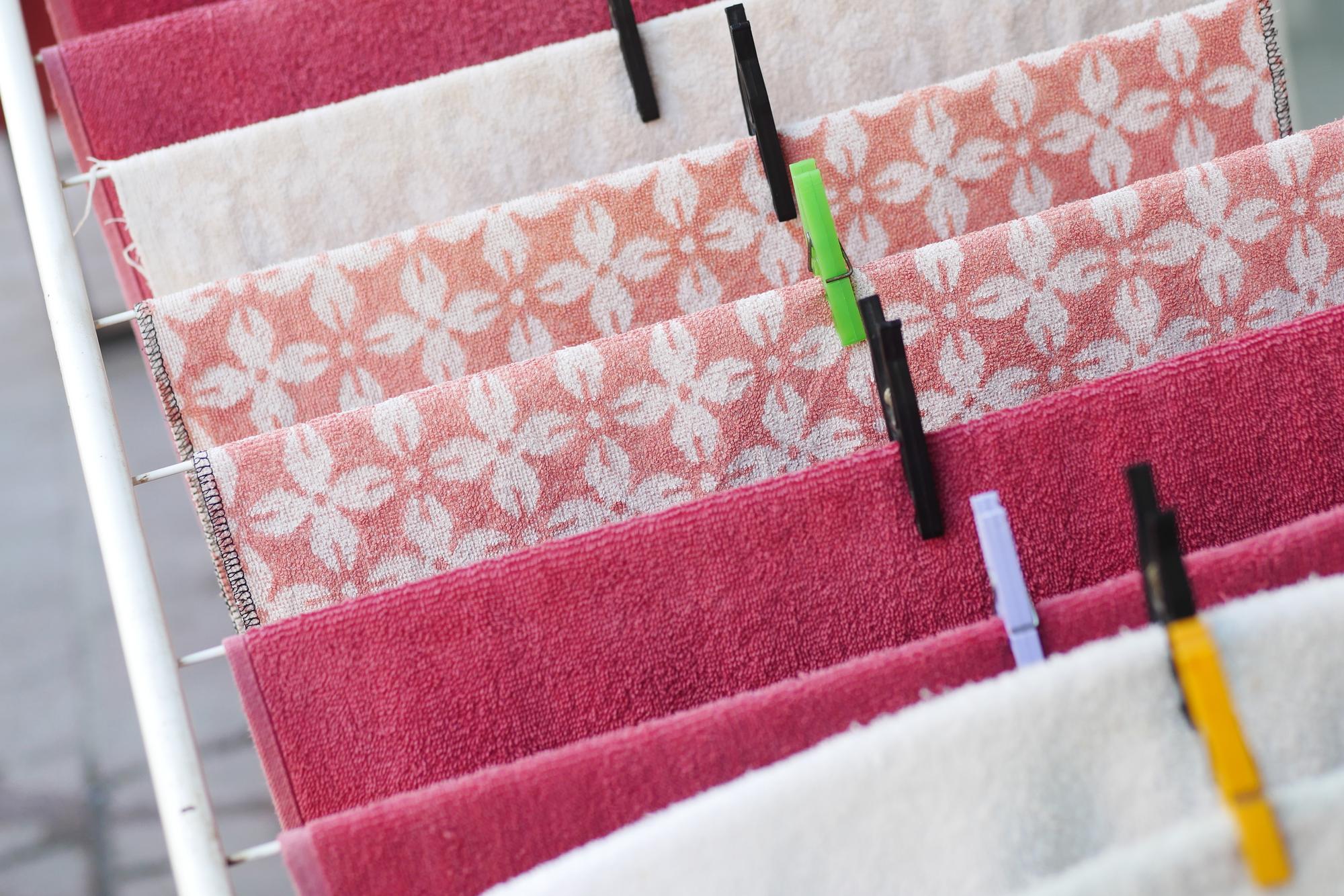 stack of embroidered samples and swatches